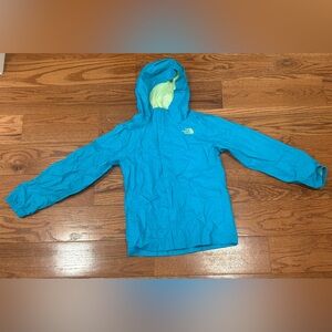 The North Face kids turquoise Hooded rain Jacket with lime green interior.